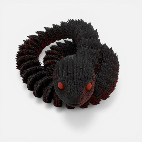 L3D Prints articulated black snake toy with red glow-in-the-dark eyes, a unique sensory toy.