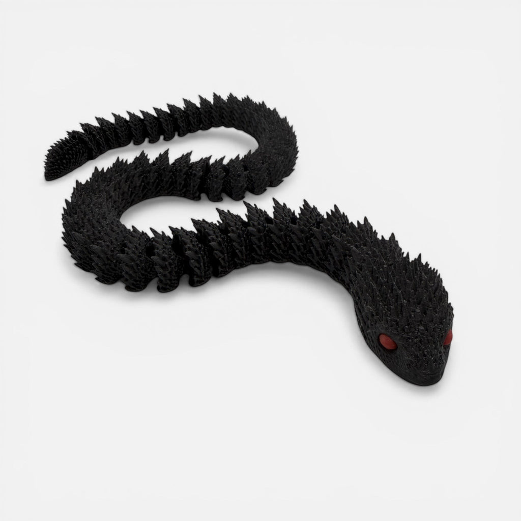 L3D Prints articulated black snake toy with red glow-in-the-dark eyes, a flexible sensory toy.