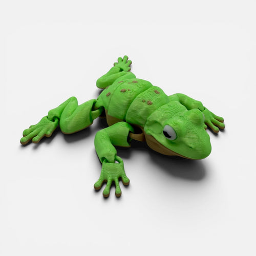 L3D Prints articulated green frog toy with brown spots and tan belly, made from 3D printed plastic.