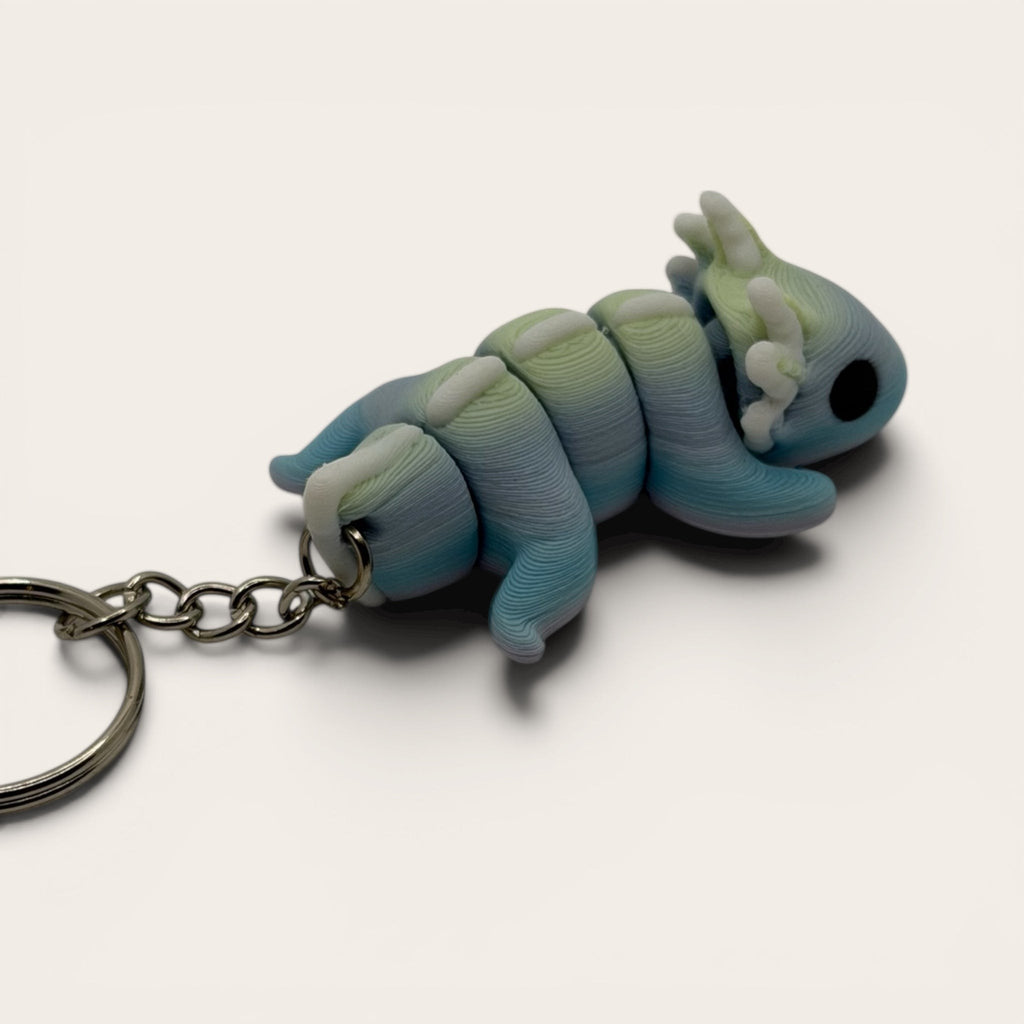 L3D Prints articulated rainbow axolotl keychain, 3D printed with colour-changing filament, flexible and sensory toy.