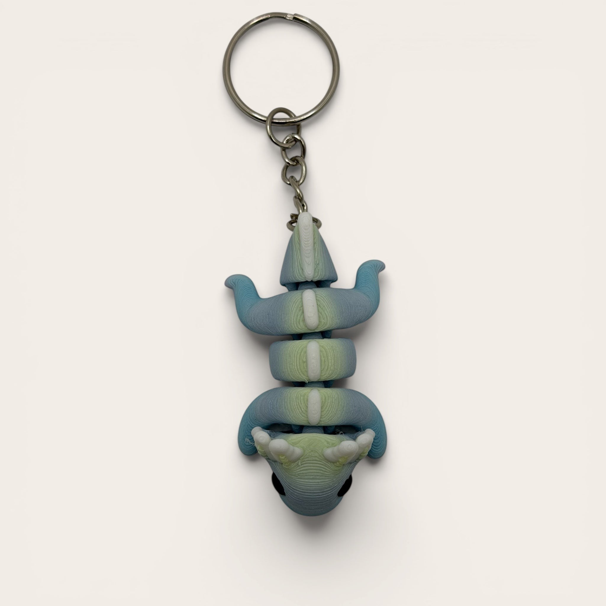 L3D Prints articulated rainbow axolotl keychain, 3D printed with colour-changing filament, flexible and fun fidget toy.